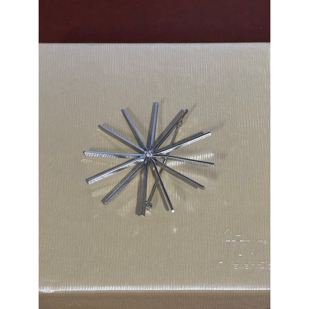 Silver toned star burst brooch pin chic classy holiday new year accent piece